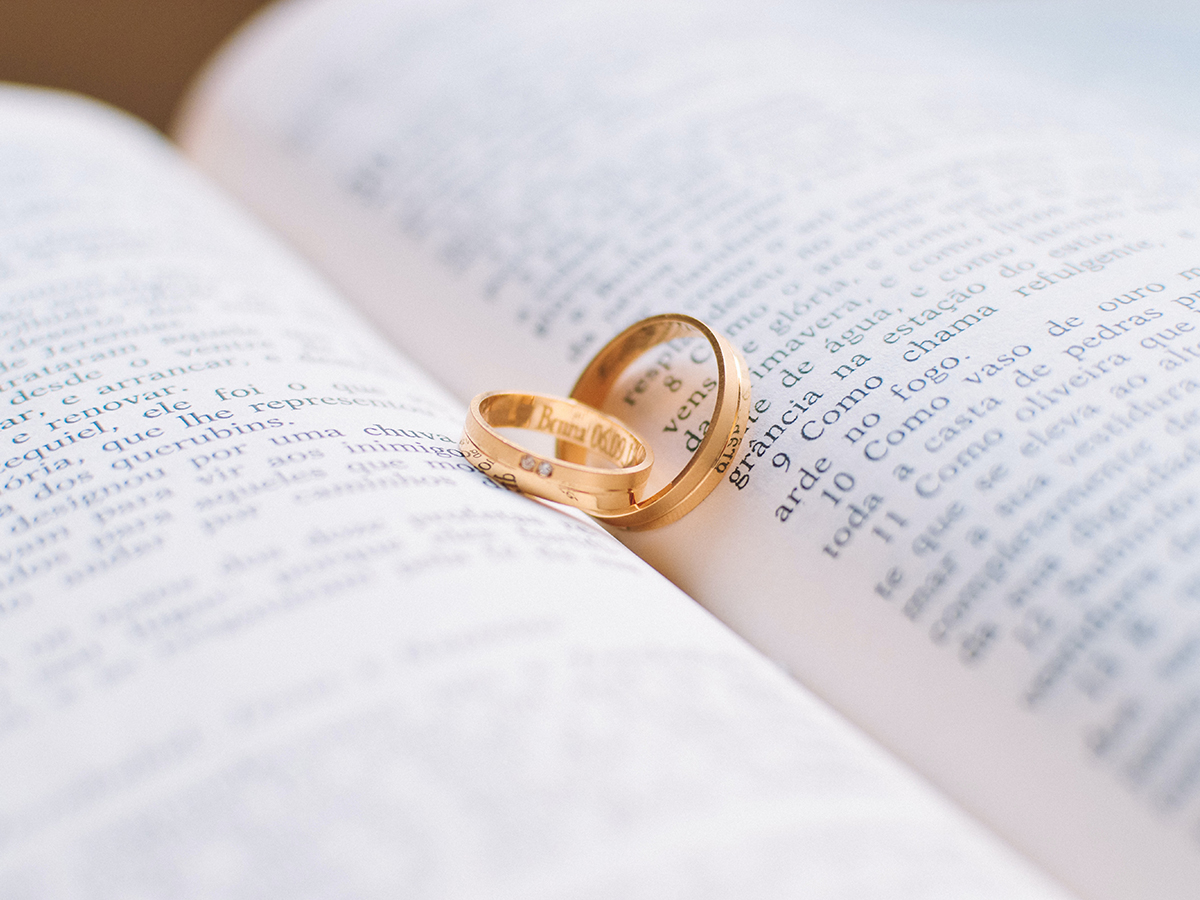 Wedding rings in the middle of an open book