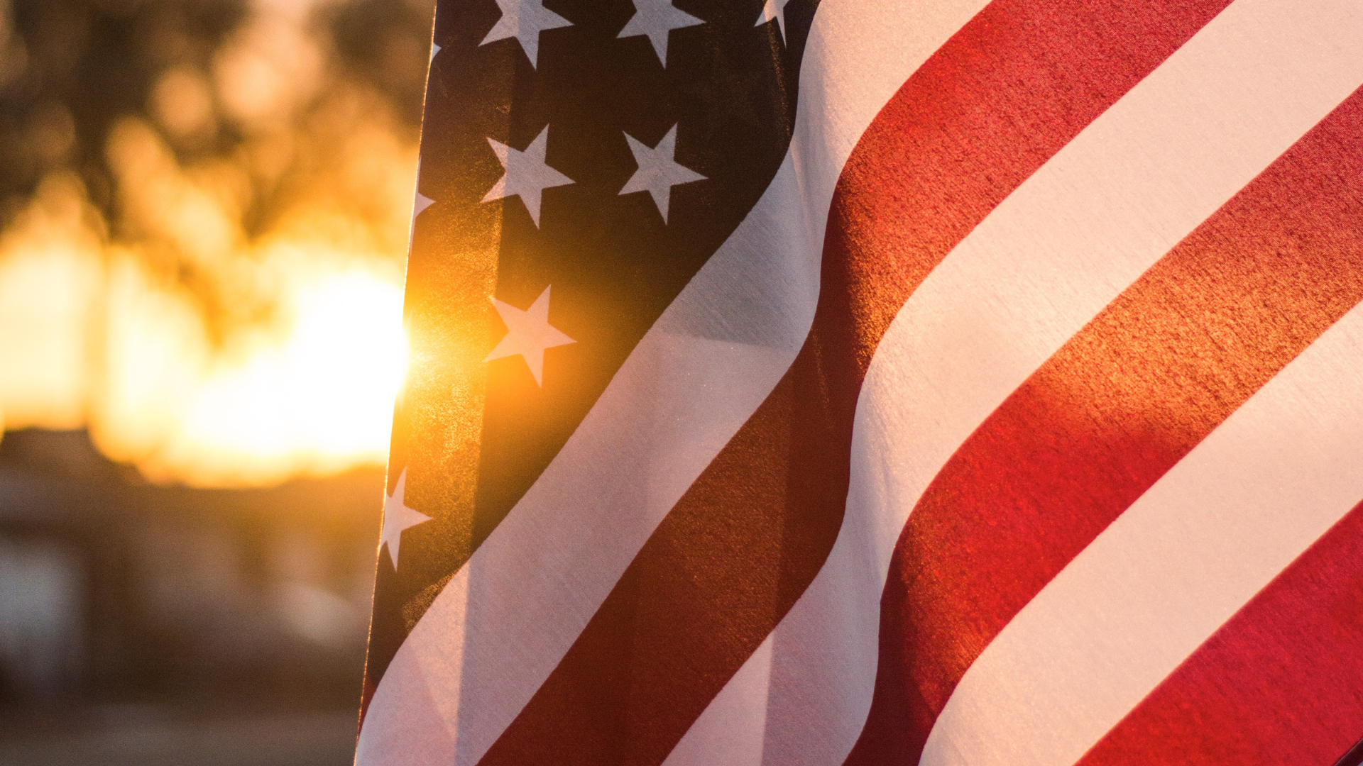 A closeup of the American flag during sunset hour