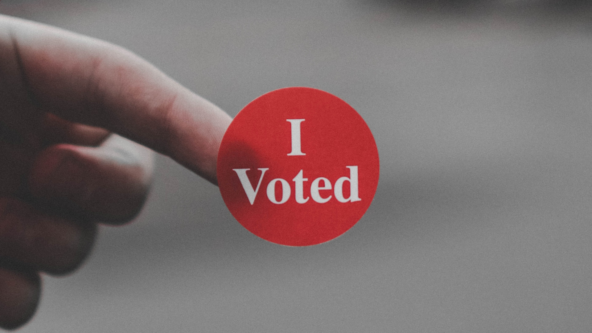 a red "I voted" sticker