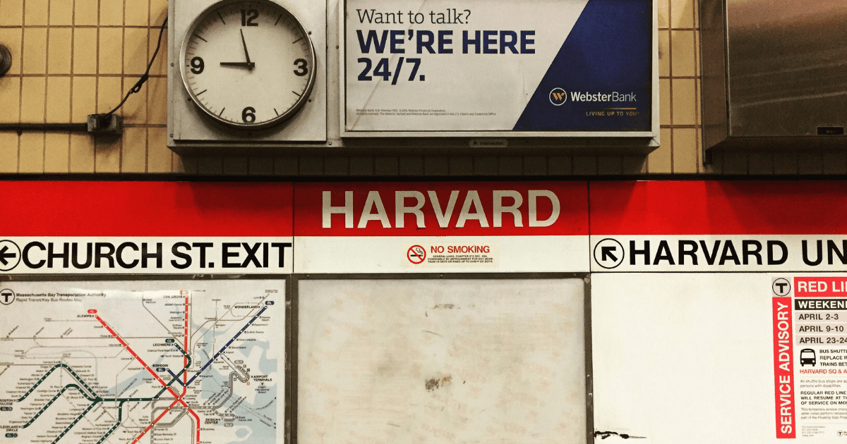 a train station sign that says "Harvard"
